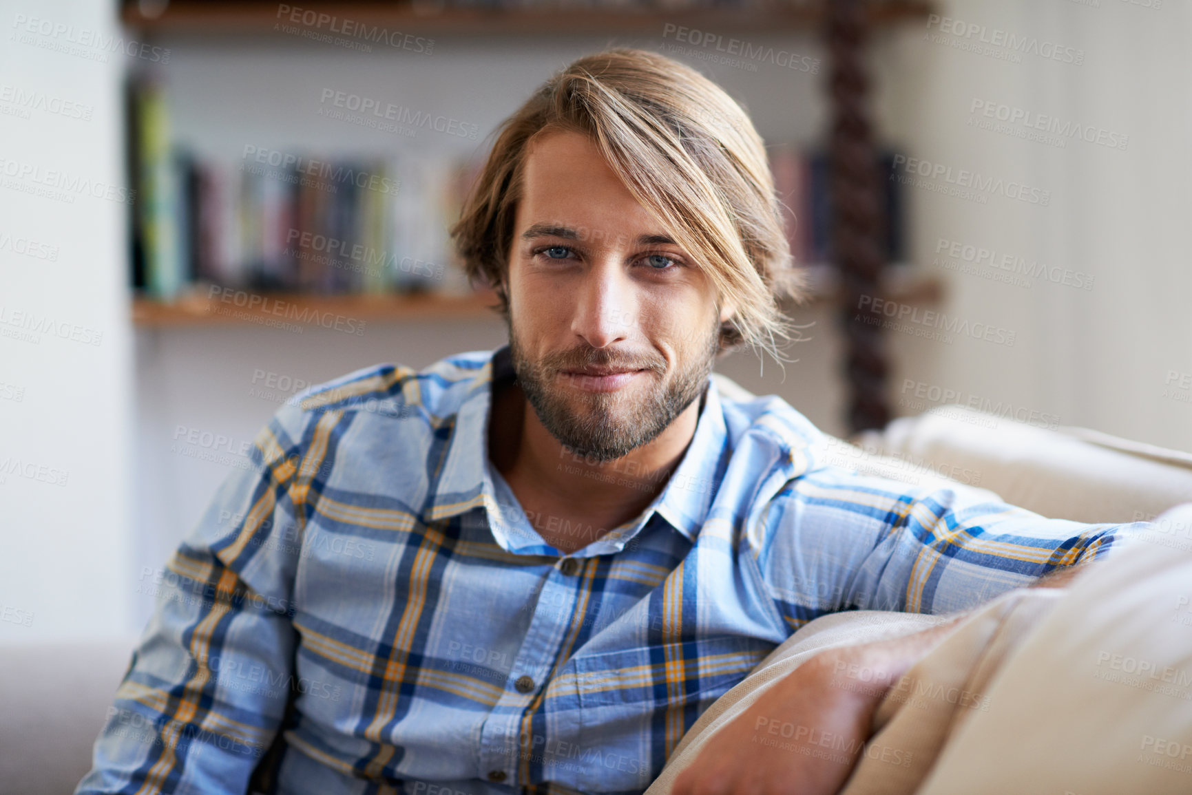 Buy stock photo Smile, peace and portrait of man on sofa in lounge of home for calm, confidence and wellness. Chill, pride and weekend break with person in living room of apartment for relax, free time and rest