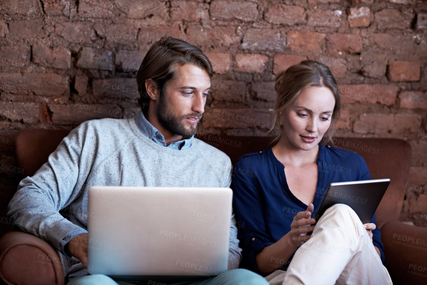 Buy stock photo Couple, tablet and laptop on sofa for internet, browsing or streaming online with connection or bonding. Man, woman and technology with relax in home, network and subscription with break together