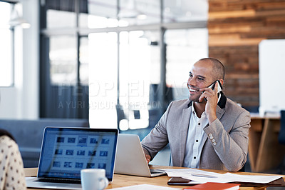 Buy stock photo Cropped shot of a handsome businessman talking on his cellphone