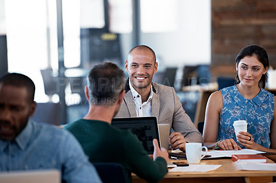 Buy stock photo Cropped shot of a group of colleagues working in the office