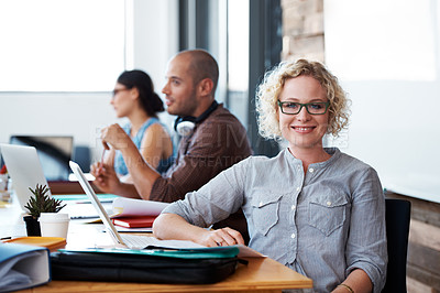 Buy stock photo Cropped shot of a group of colleagues working in the office