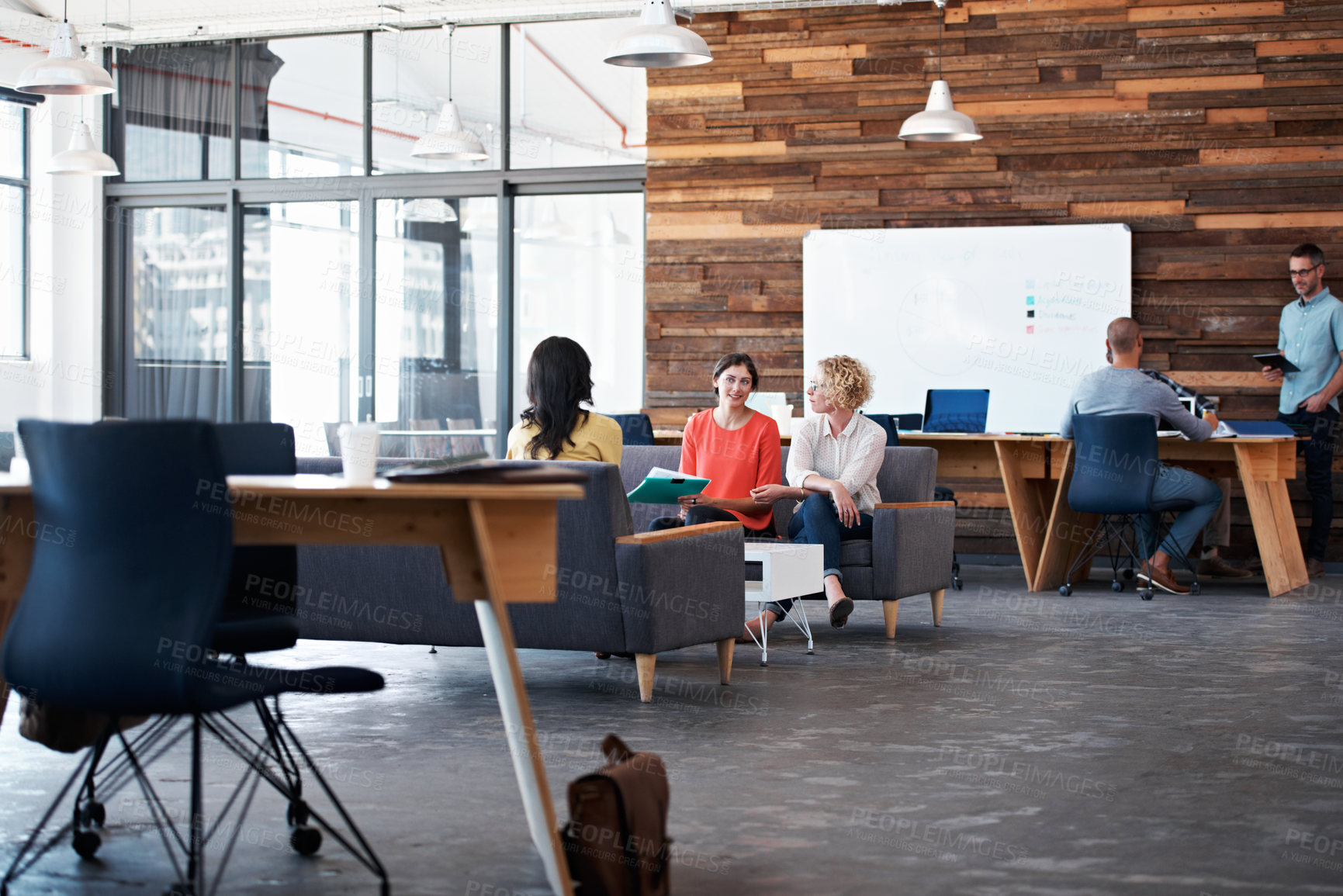 Buy stock photo Creative, people and conversation in office with meeting, data report and plan for team productivity. Coworkers, discussion or collaboration in business with KPI stats, charts or performance metrics.