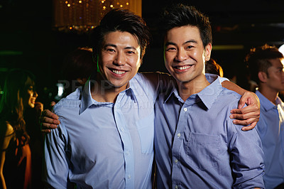 Buy stock photo Portrait of a two male friends enjoying a night out in a club