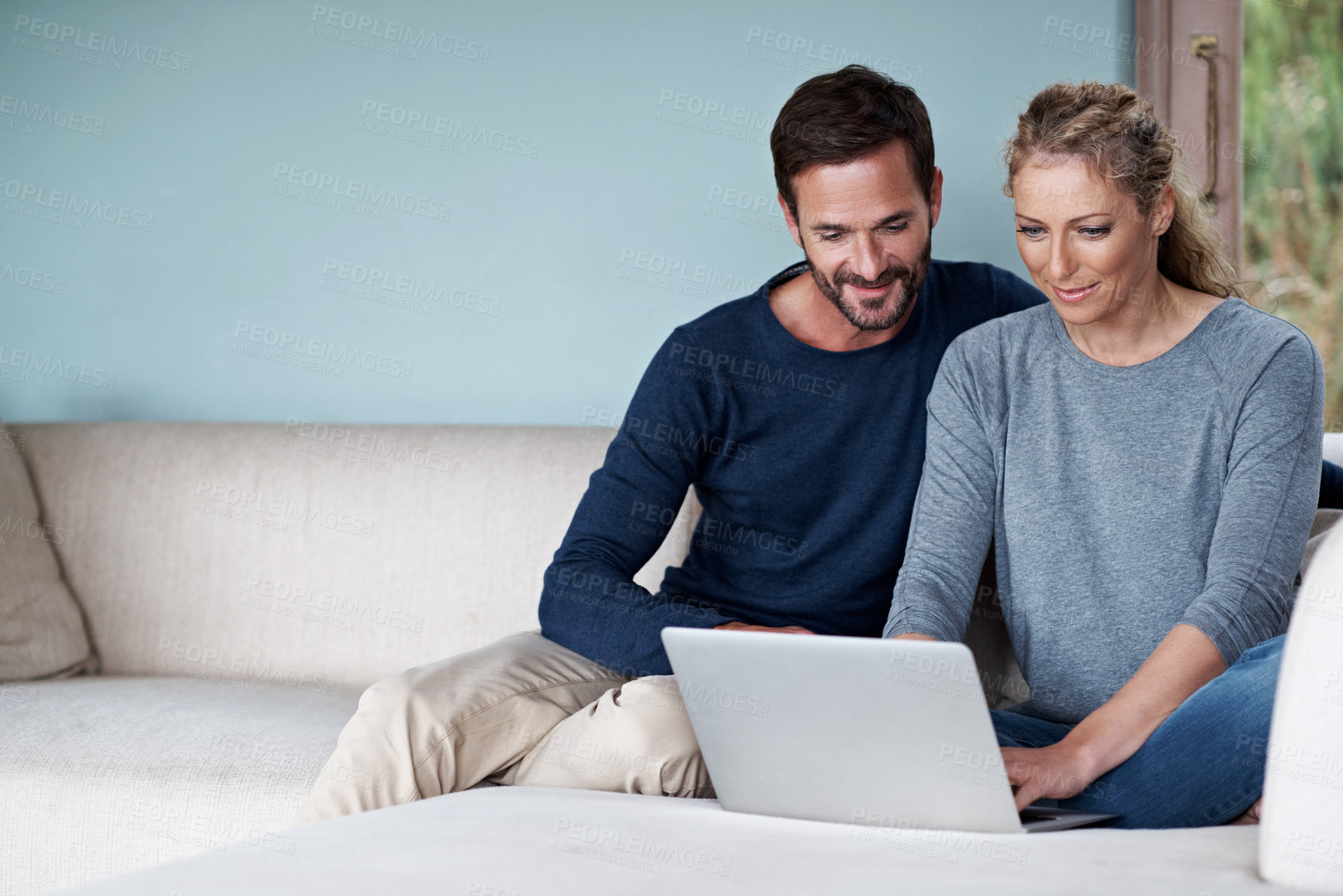Buy stock photo Laptop, smile and couple on sofa in home with reading blog on finance tips, investment or savings. Relax, technology and mature man with woman on computer for article with financial advice by space.