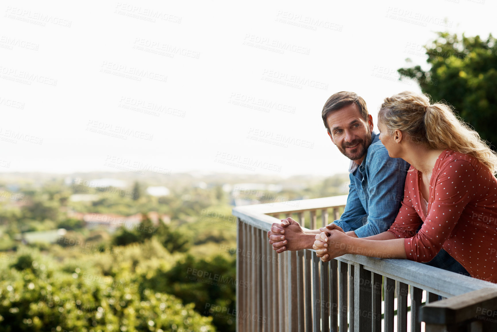 Buy stock photo Smile, talking and balcony with couple by home for bonding, connection and relax together. Happy, commitment and love with man and woman on deck of house for marriage partner, support and security
