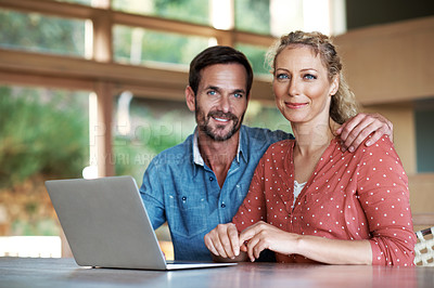 Buy stock photo Portrait of a couple using a laptop at home