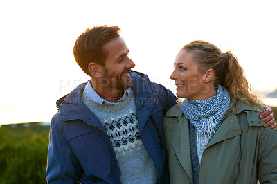 Buy stock photo Cropped shot of an affectionate couple standing outdoors