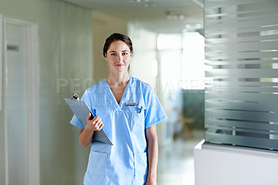 Buy stock photo Portrait of a beautiful young doctor standing in a hospital