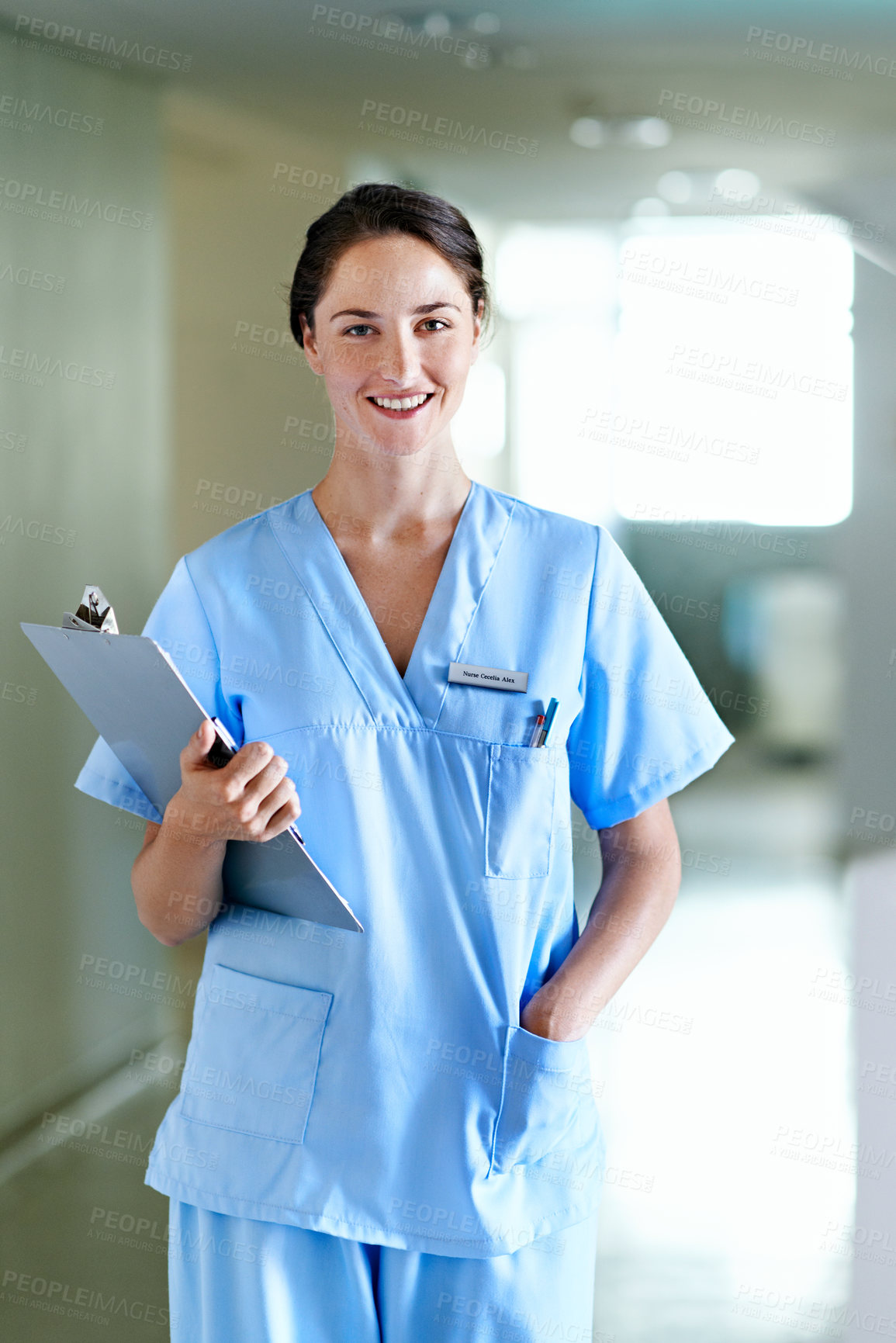 Buy stock photo Clinic, nurse or smile with medical checklist for patient care, health records or residency pride. Portrait, happy woman or clipboard in hallway for ward round, healthcare service or career integrity