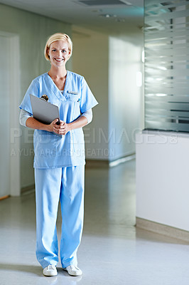 Buy stock photo Portrait of a beautiful young doctor standing in a hospital