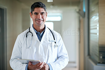 Buy stock photo Portrait of a confident mature doctor standing in a hospital