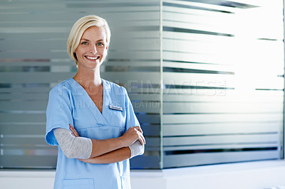 Buy stock photo Portrait of a beautiful young doctor standing in a hospital