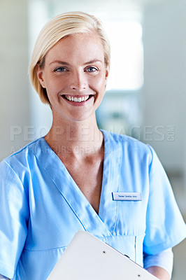Buy stock photo Portrait of a beautiful young doctor standing in a hospital