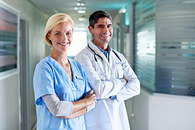 Buy stock photo Portrait of two confident doctors standing together in a hospital
