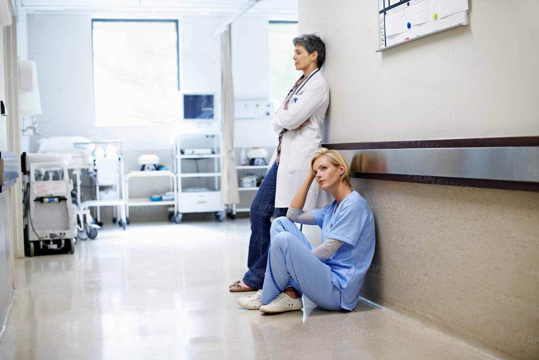 Buy stock photo Medical team, nurse and tired in hospital with thinking, mental exhaustion and overwhelmed by shift. Healthcare staff, woman and reflection in corridor for clinic workload, burnout risk or overworked