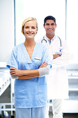 Buy stock photo Portrait of two confident doctors standing together in a hospital