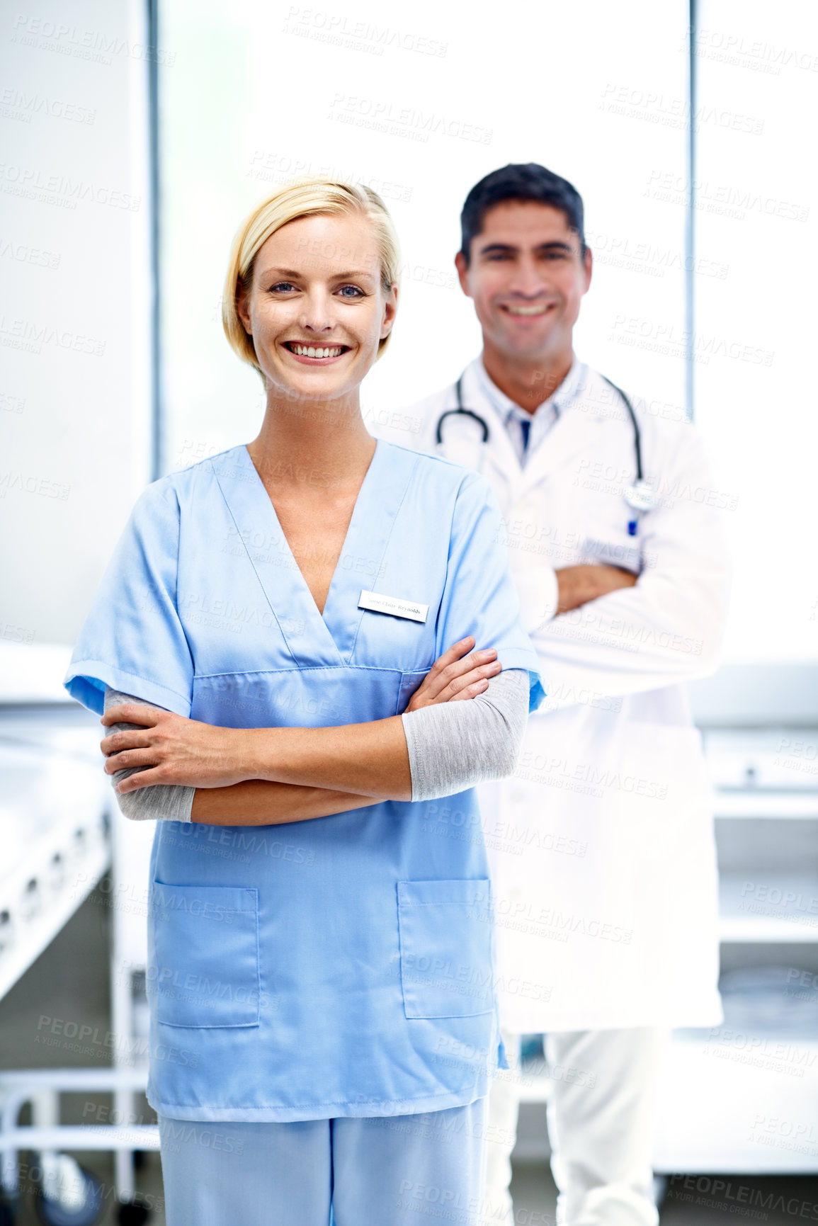 Buy stock photo Nurse, team and arms crossed in clinic for medical support, primary healthcare and about us pride. Staff leader, woman and doctor with confidence in ward for patient care, health portrait and happy