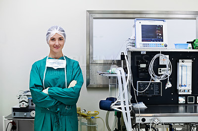 Buy stock photo Portrait of a confident surgeon standing next a heart monitor in an operating room