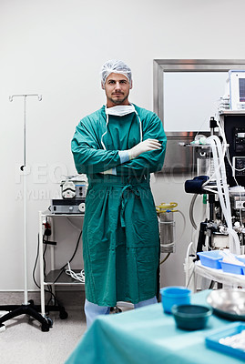 Buy stock photo Portrait of a confident surgeon standing in an operating room