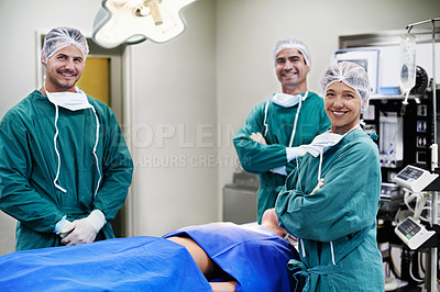 Buy stock photo Portrait of a team of surgeons in an operating theatre