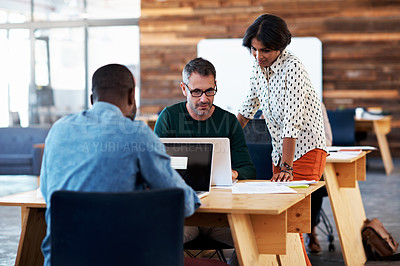 Buy stock photo Cropped shot businesspeople working in an office