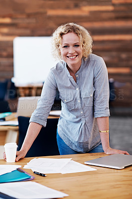 Buy stock photo Cropped portrait of a blonde businesswoman standing by her desk