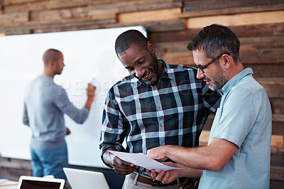 Buy stock photo Cropped shot of three businessmen in an office