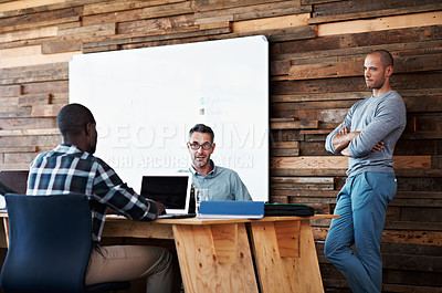 Buy stock photo Cropped shot of three businessmen in an office