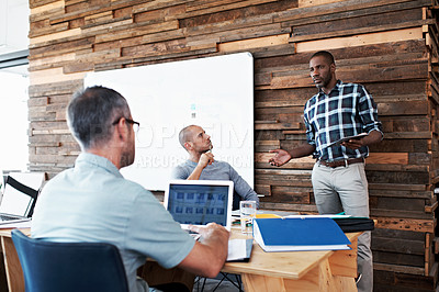 Buy stock photo Cropped shot of three businessmen in an office