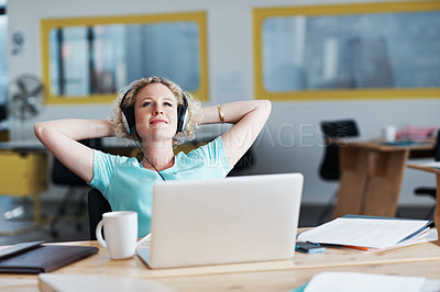 Buy stock photo Cropped shot of a businesswoman looking relaxed at her desk