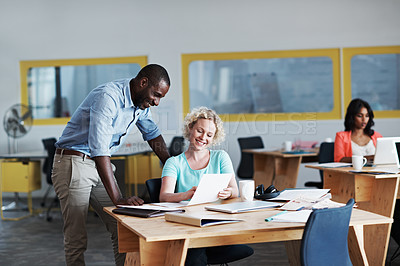 Buy stock photo Cropped shot of a businessman helping a female colleague