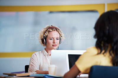 Buy stock photo Cropped shot of two businesswoman in an office
