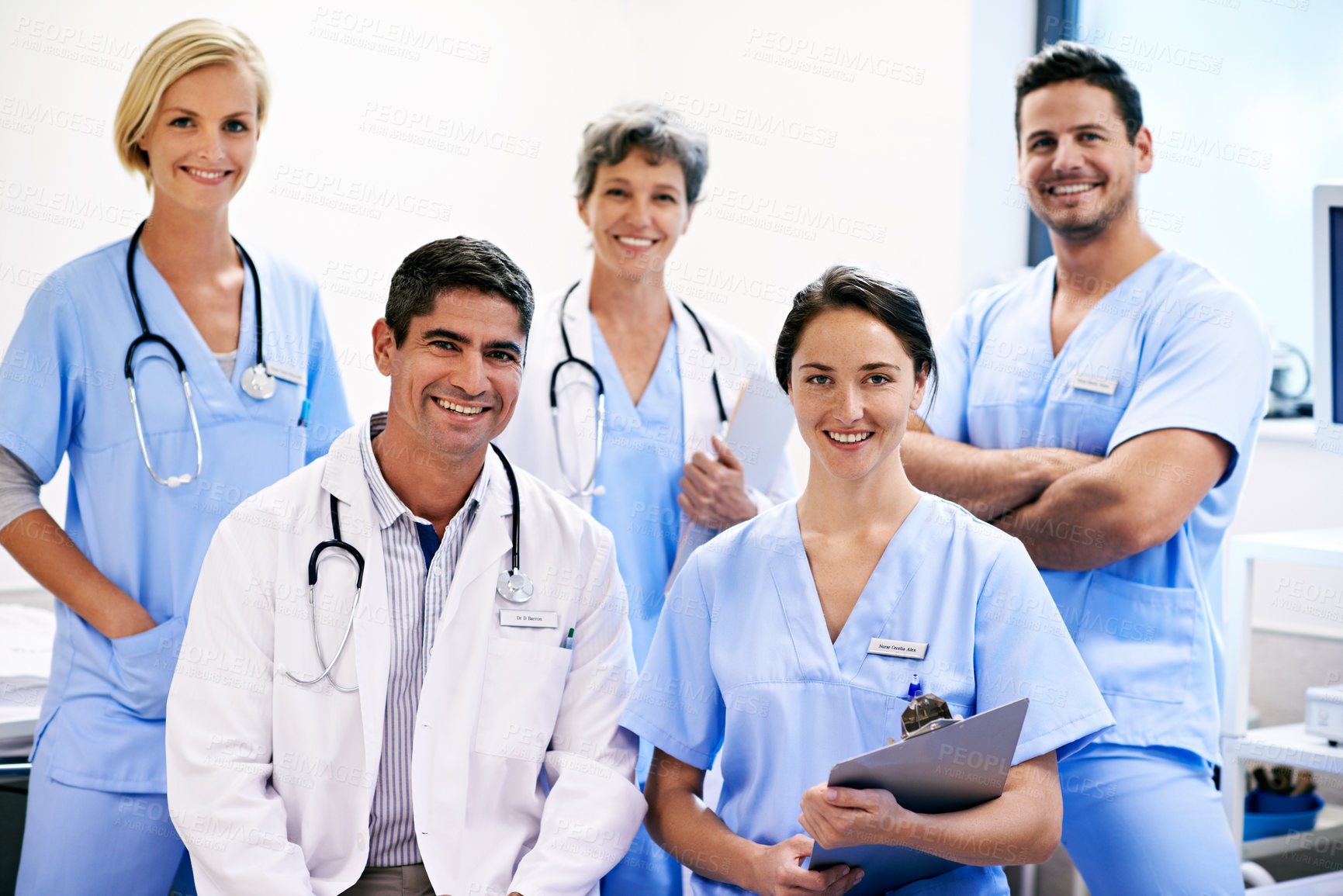 Buy stock photo Medical, team and happy portrait in clinic for patient care, service ready and primary health. People, doctors and nurses with clipboard in ward for healthcare integrity, shift start and confidence