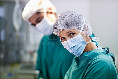 Buy stock photo Portrait of a group of surgeons at work in an operating theater