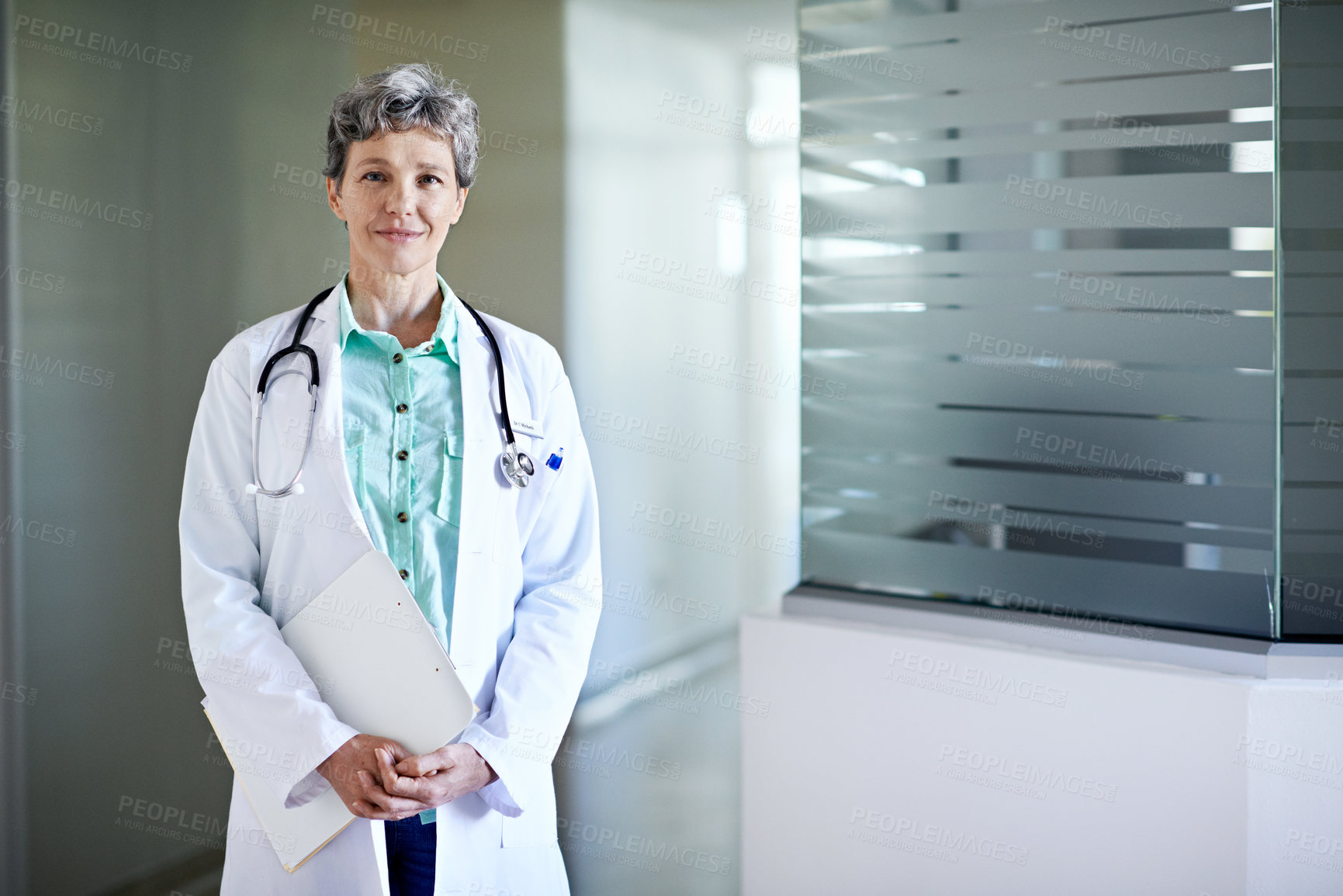 Buy stock photo Space, portrait and doctor in hospital for medical service, healthcare career and wellness. Happy, clipboard and woman in clinic for health support, insurance and friendly consultant for about us