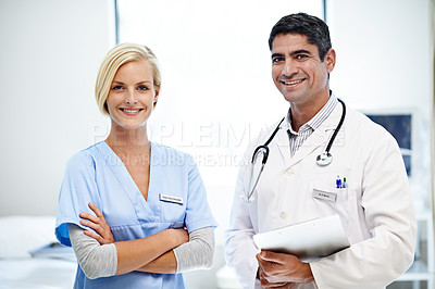 Buy stock photo Portrait of two confident doctors standing together in a hospital