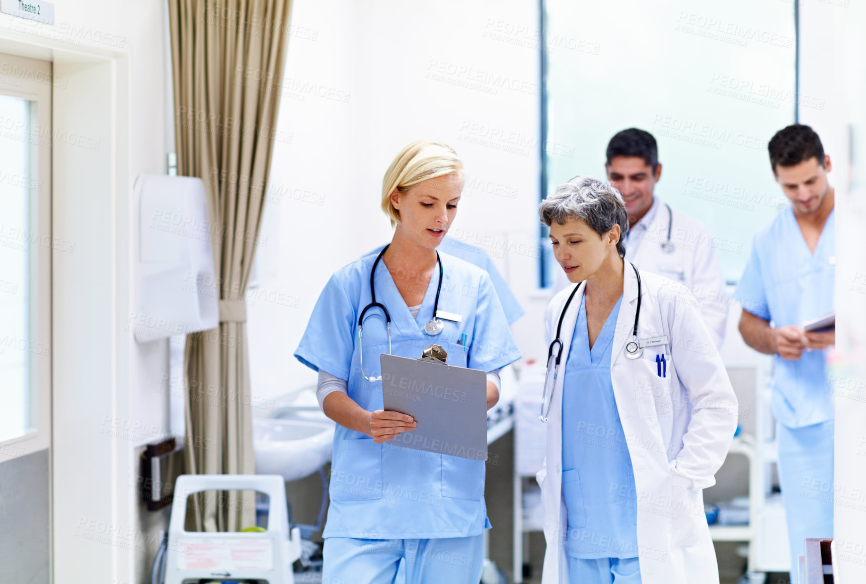 Buy stock photo Hospital, doctors and women with clipboard, info and talking with intern for treatment plan or help. Medical professional, mentor and people with checklist, collaboration and reading health report