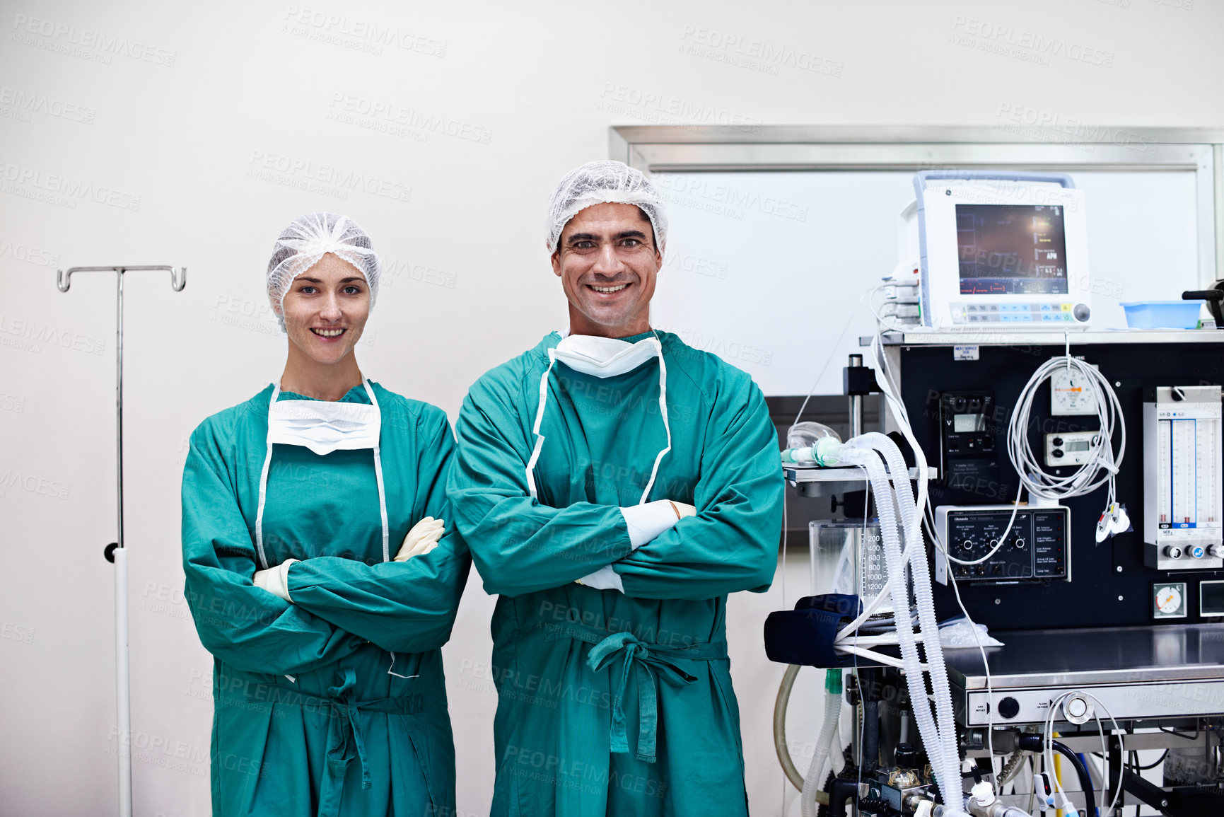 Buy stock photo Portrait of two surgeons standing by equipment in an operating room