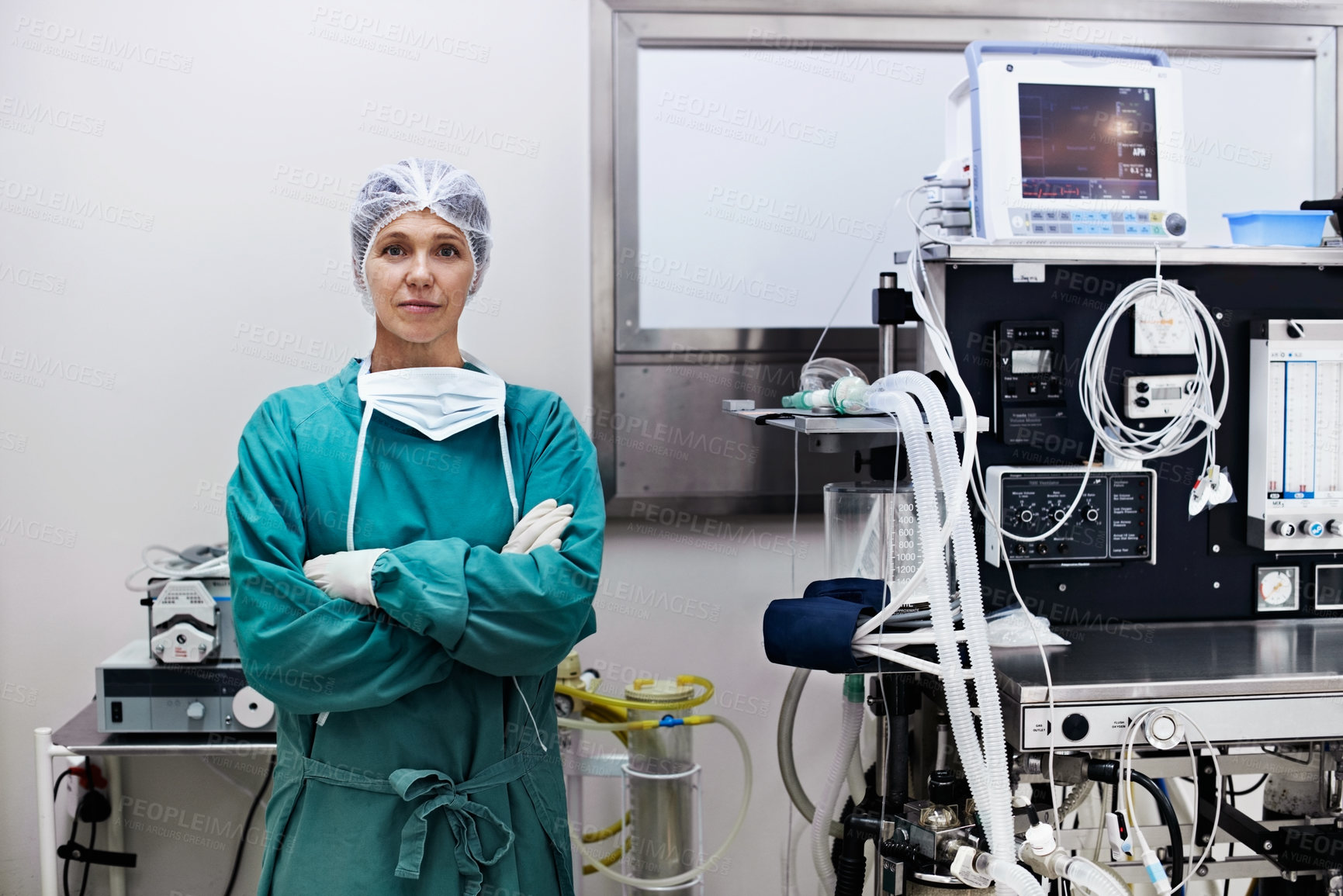 Buy stock photo Arms crossed, portrait and serious surgeon in hospital for help, operation or specialist procedure. Care, doctor and scrubs with mature woman in operating room for medical support, theater or trust