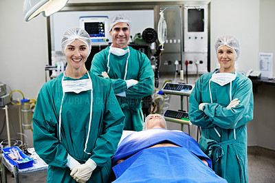 Buy stock photo Portrait of surgeons working on a patient in an operating room