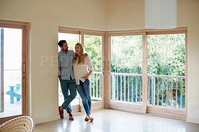 Buy stock photo Shot of an affectionate couple in their home