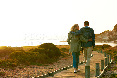 Buy stock photo Rearview shot of an adventurous couple walking outdoors