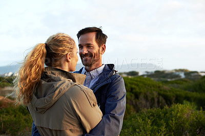 Buy stock photo Cropped shot of an affectionate couple standing outdoors