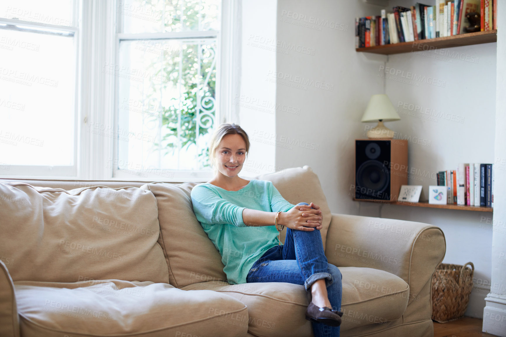 Buy stock photo Portrait of a woman relaxing on her living room sofa