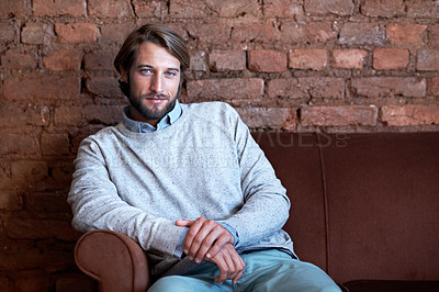 Buy stock photo Portrait of a young man sitting on a couch