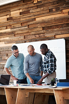 Buy stock photo Cropped shot of three businessmen in an office