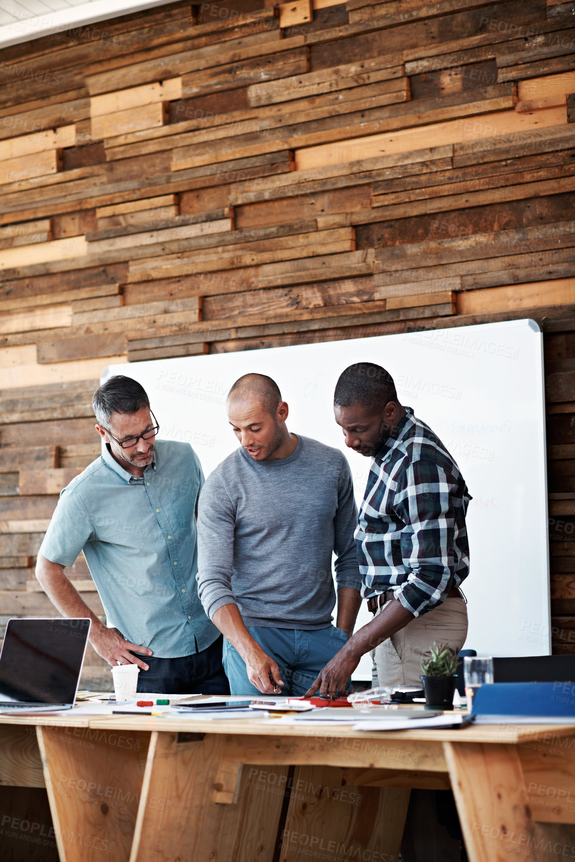 Buy stock photo Cropped shot of three businessmen in an office
