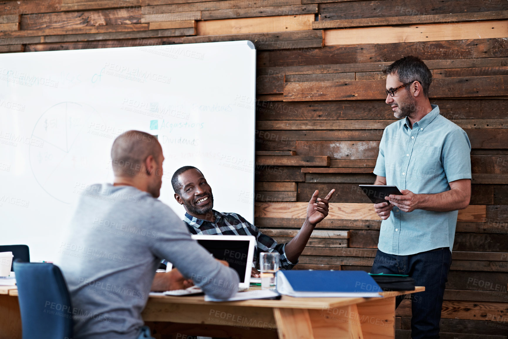 Buy stock photo Cropped shot of three businessmen in an office