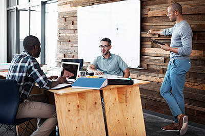 Buy stock photo Cropped shot of three businessmen in an office