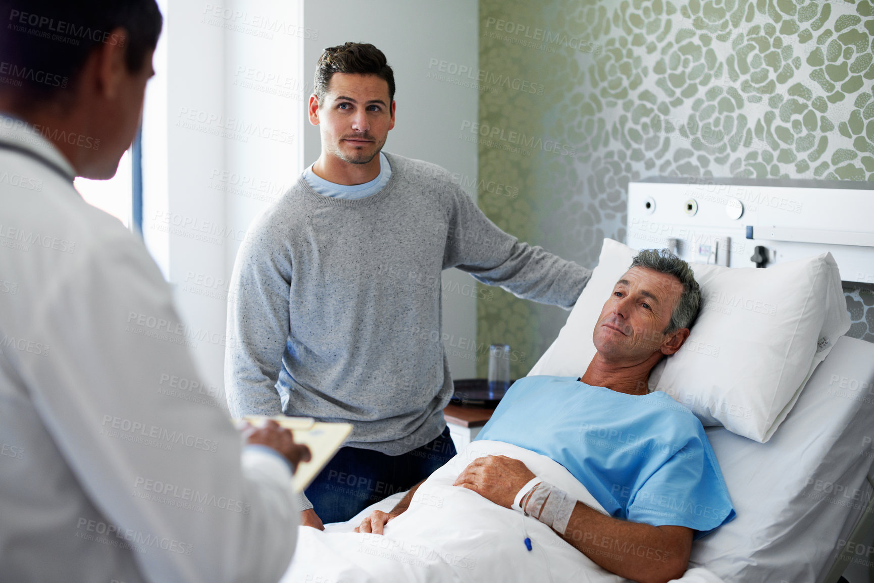 Buy stock photo Man, family and doctor at hospital bed with results, clear pathology report and care coordination. Adult son, patient and worker with medical records for discharge news, recovery update and support